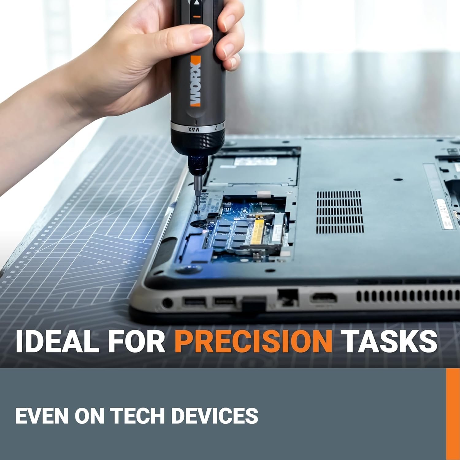 The WORX electric screwdriver being used for a precision task on the internal components of a laptop, demonstrating it is "Ideal for precision tasks".