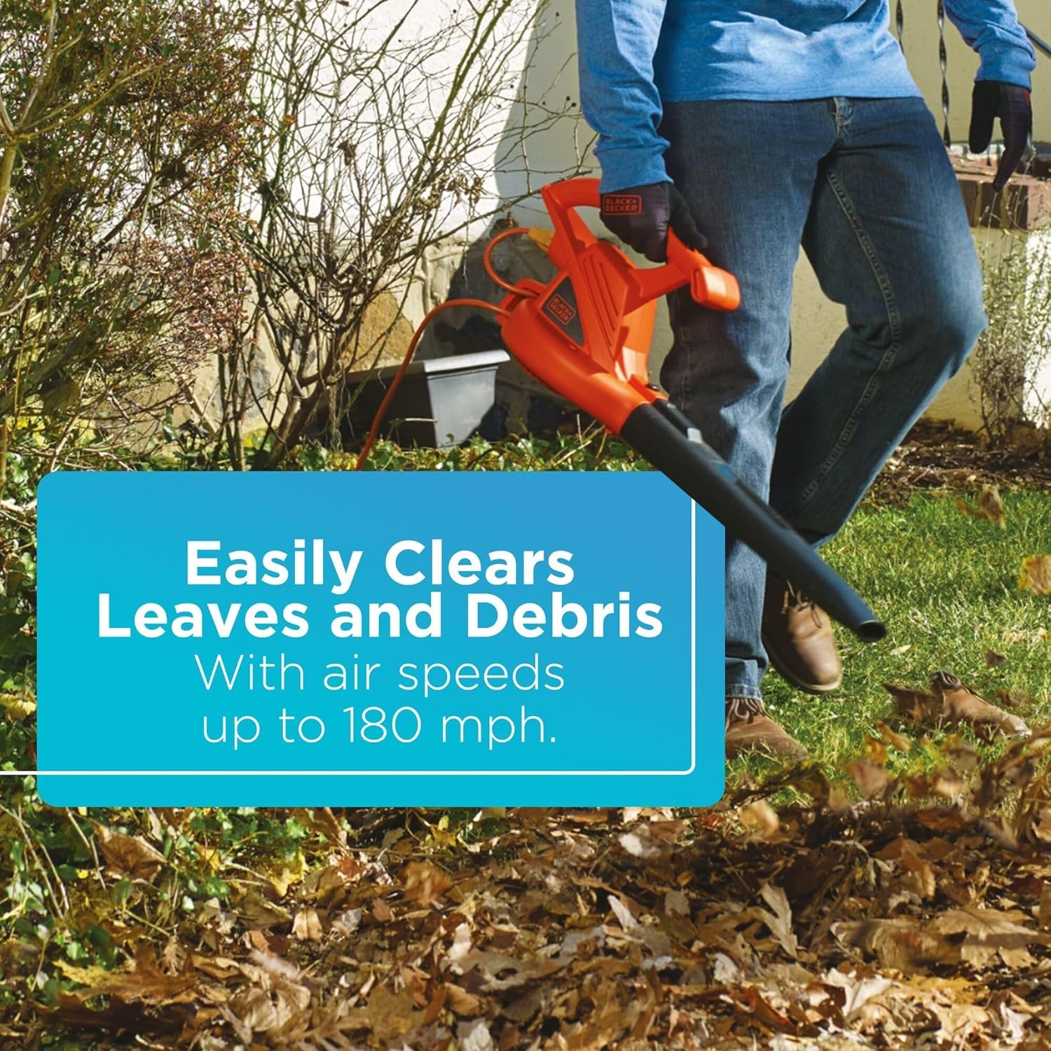 A person using the BLACK+DECKER leaf blower to clear leaves, with a text overlay: "Easily Clears Leaves and Debris / With air speeds up to 180 mph."