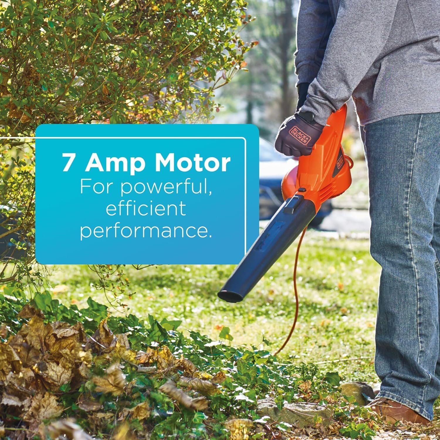 A person clearing leaves with the BLACK+DECKER leaf blower, with a text overlay: "7 Amp Motor / For powerful, efficient performance."