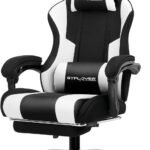 A front-on studio shot of the GTPLAYER black and white gaming chair, showing the headrest pillow, lumbar support pillow, and chrome base.
