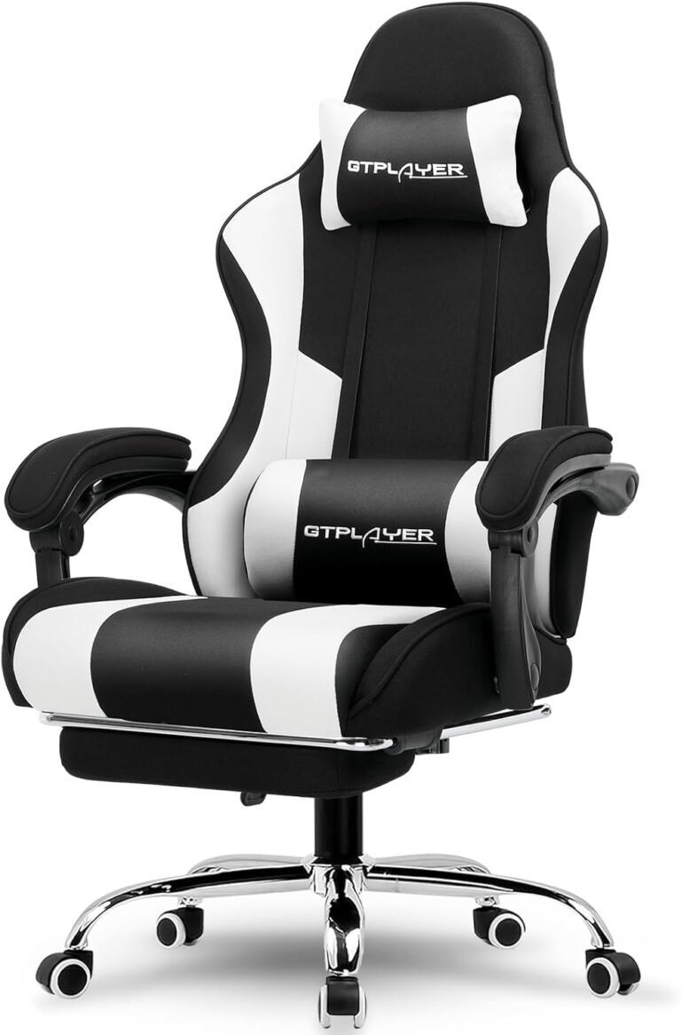 A front-on studio shot of the GTPLAYER black and white gaming chair, showing the headrest pillow, lumbar support pillow, and chrome base.
