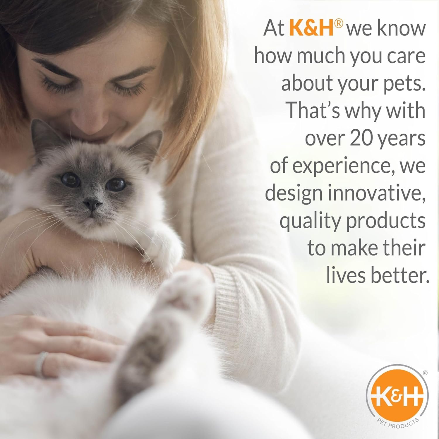 A lifestyle image from K&H Pet Products showing a woman affectionately holding a fluffy cat, with text about the brand's 20 years of experience.